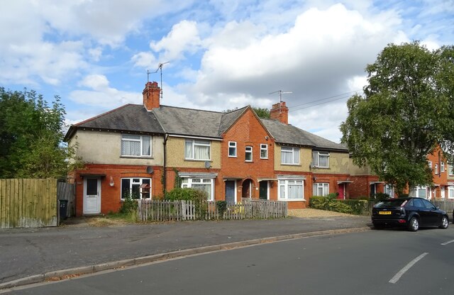 A residential street in Rushden, with brick houses and front gardens